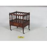 An attractive carved George III period mahogany Music Canterbury, with turned rails.