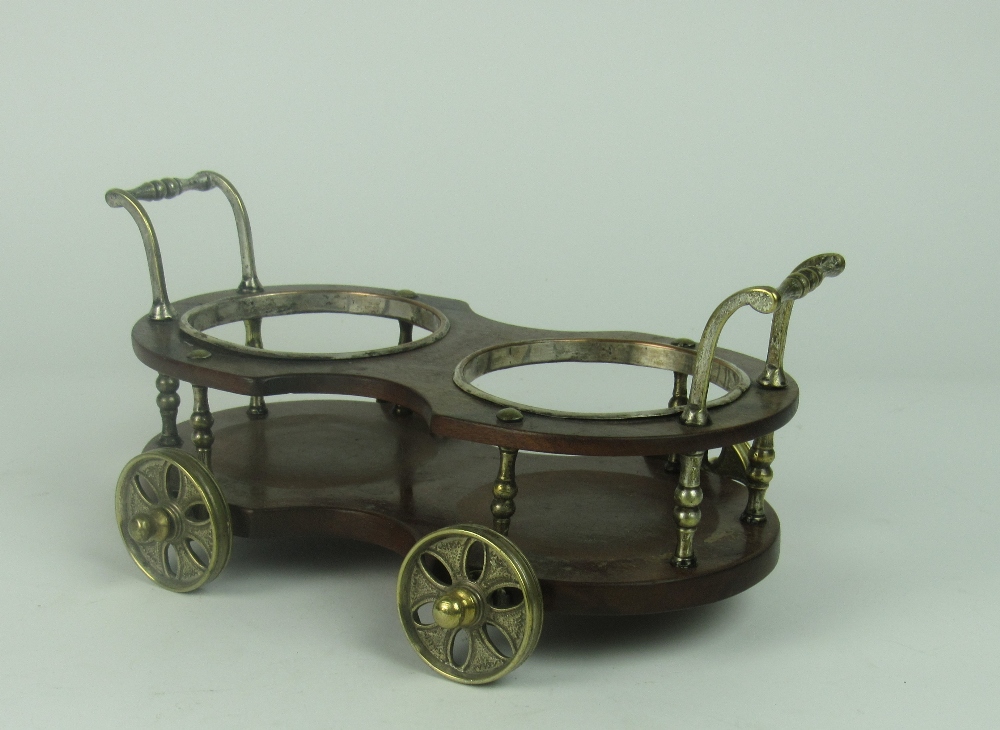 A mahogany and silver plated double Wine Coaster in the shape of a cart,