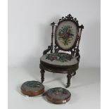 A Victorian walnut Corner Chair of low proportion with shield shaped upholstered back and seat,