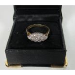 A Marquise shape 18ct gold (3.8gms) Ring, with 13 pave style diamonds (total ct. .