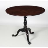 An Irish George III period mahogany circular flip top Table, on tripod base with turned support,