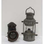 A small metal Ships Oil Lamp, with brass plaque 'Anchor,' and a small metal Bicycle Lamp.