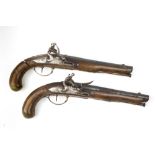 A matching pair of early 19th Century Flintlock Dueling Pistols, with 22cms (8 1/2") blued barrels,