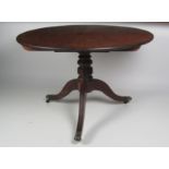 A fine George III circular mahogany Dining Table, the flip top with rosewood crossbanded rim,