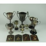 A collection of 8 silver plated and silver miniature two handled Trophies,
