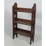 An attractive small Open oak Bookcase, with pierced decorated open sides,