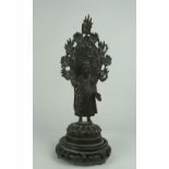 An antique Chinese bronze Stele, with attractive decoration on circular base, 29cms (11 1/2") high,