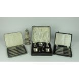 A cased silver Condiment Set, two cased sets of 6 Fruit Knives,