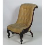 A heavy early Victorian period carved rosewood Nursing Chair.