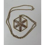 An unusual gold plated silver hexagonal Pendant, the centre designed in shape of a snowflake,