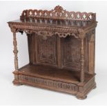 A tall 19th Century carved oak Buffet, with attractive carved and pierced back rail,