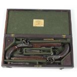An exceptionally fine cased pair of early 19th Century Irish Flintlock Dueling Pistols,