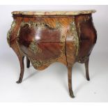 An early 19th Century Louis XV style bombé shaped Commode, in kingwood, coromandel,