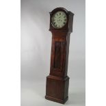 A small Victorian figured mahogany Grandfather Clock, the circular enamel dial with Roman numerals,