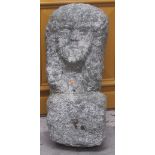 A Medieval type Carving of a Gentleman's Head, in granite, 64cms (25") high.
