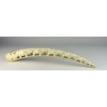 A carved Oriental ivory Tusk, in the form of a six elephant bridge, 56cms (22") long.