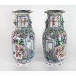 A large pair of Cantonese Vases, each decorated in bright enamels with panels of Oriental figures,