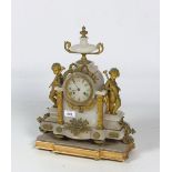 An ormolu mounted alabaster Mantel Clock, dial signed J. Hackett.