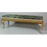 A 19th Century French style long Stool, with blue silk damask seat, on a painted base,