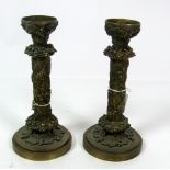 A pair of heavy bronze 19th Century French Candlesticks, with leaf and fruit decoration,
