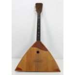 A Russian Balalaika, with indistinct description dated 5/5/72 in Russian.