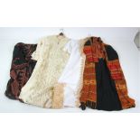 A large collection of Middle Eastern Dresses & Gowns, very colourful, some embroidered,