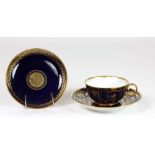 A 19th Century French Louis XVIII blue ground and gilt highlighted Sevres Cup, Saucer and Plate.