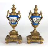 A pair of tall 19th Century gilt bronze and porcelain Urns,