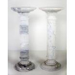 An almost matching pair of white marble circular Pillar Stands, each approx. 91cms (36") tall.