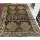 A late 19th Century Oriental heavy pile brown ground woollen Rug, approx.