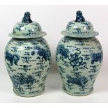 A pair of 18th Century style blue and white Chinese large bulbous Pots and Covers,