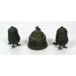 An unusual pair of small heavy bronze Pots, modelled in the shape of birds, with hinged lids,
