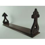 A 19th Century Irish mahogany Table Shelf, with pierced carved ends on moulded base, approx.