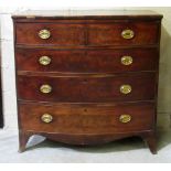 A Georgian period figured mahogany bow fronted Chest, of two short and three long drawers,