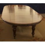 A fine quality Irish Victorian D end extendable Dining Table, with three extra leaves,