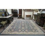 A large blue ground floral Ziegler Carpet, the wide centre with interleaved design,