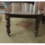 A Victorian extendable mahogany D end Dining Table, with two spare leaves,