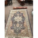 A very good small fawn ground Carpet, with large central medallion,