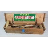 A cased Croquet Set, by Jaques of London, with mallets, balls, original label and rule book.