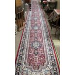An attractive and long woolen Runner, with dark ground centre,