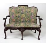 An 18th Century Irish style mahogany two seater Settee, with shaped and scroll back,