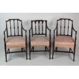 An attractive pair of Hepplewhite style Armchairs, with rail backs outstretched arms,