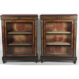 A pair of Victorian ormolu mounted ebonised Vitrines,