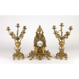 A 19th Century French gilt bronze Clock Garniture, in the rococo style,