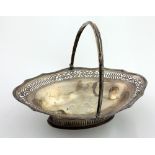A large and very attractive English silver Fruit Basket, with pierced and engraved shaped rim,