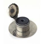 An Edwardian silver desk Inkwell, on circular base with hinged lid, with glass liner,