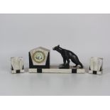 An attractive art Deco marble Clock Garniture, surmounted with a bronze brown bear, painted dial,