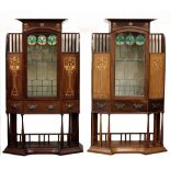 An important almost matching pair of Art Nouveau mahogany and marquetry Display Cabinets, c.