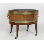 A Georgian period oval brass bound mahogany Wine Cooler,