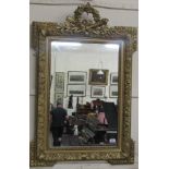An attractive upright 19th Century French Mirror, with carved and decorated cartouche,